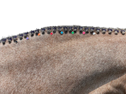 Side view of a roan horse's braided mane with various colored clover Dubois Cheval Braid Charms