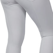 Close-up side view of a model wearing the white B Vertigo Olivia Sillicon Full Seat Breeches on a white background