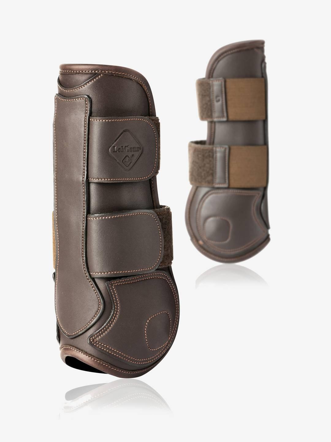 Side views of a pair of brown LeMieux Capella Tendon Boots on a white background