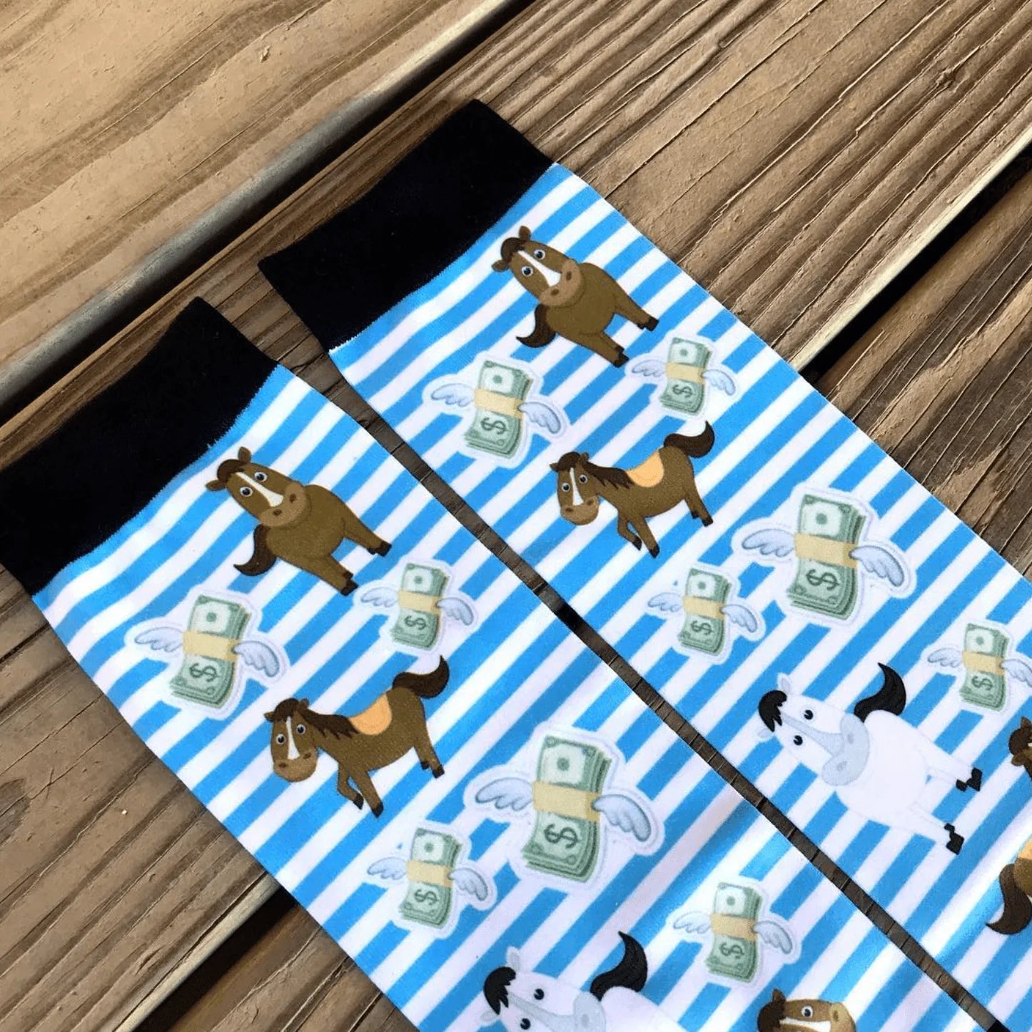 Close-up view of the Cash Money Dreamers & Schemers Pair & A Spare Boot Socks on a wood plank background