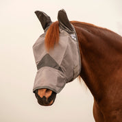 Angled front view of a chestnut horse wearing the gray arabian Cashel Crusader Fly Mask with Long Nose and Ears on a plain background
