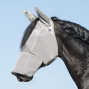 Side view of a black horse wearing the gray warmblood Cashel Crusader Fly Mask with Long Nose and Ears against a blue sky background