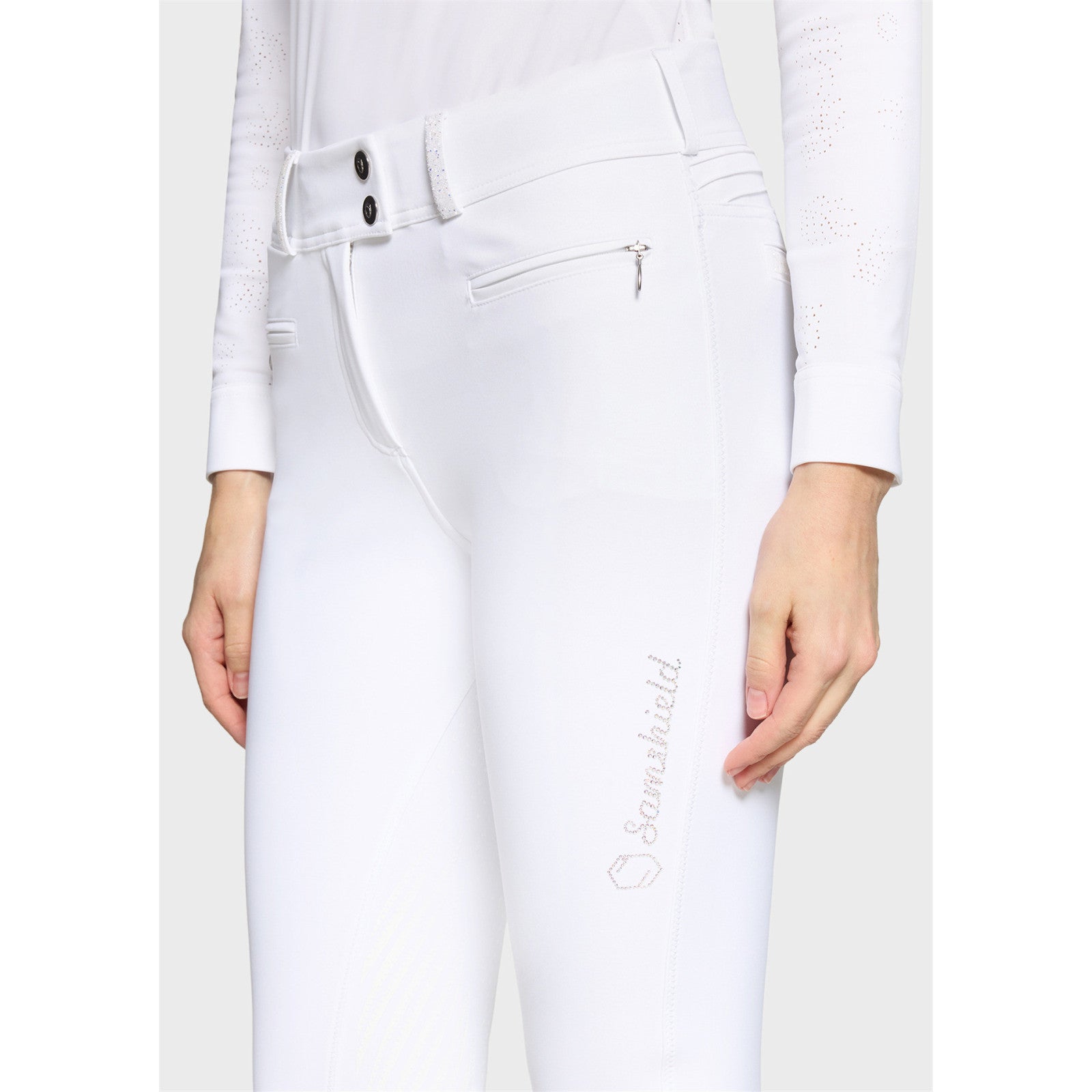 Close-up angled front view of a female model wearing the white Samshield Clara Premium Full Grip Breeches