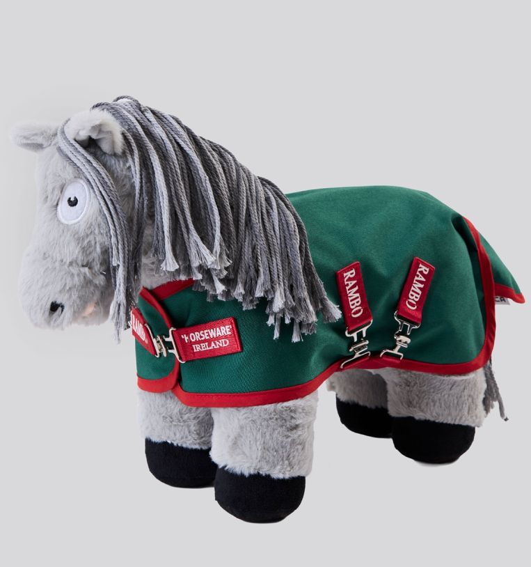 Front angled view of a gray stuffed animal pony wearing Rambo turnout blanket that is green with red accents