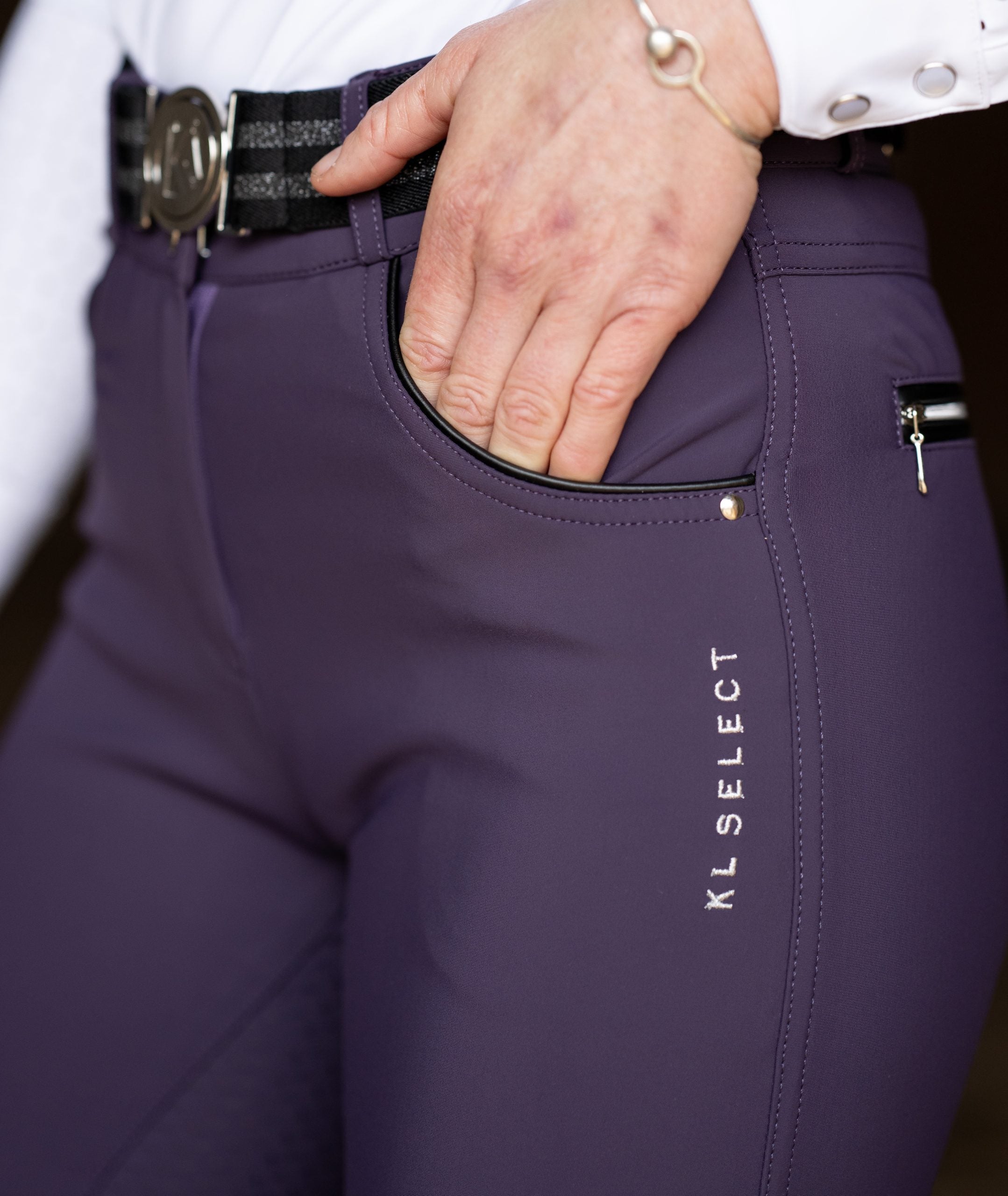 Close-up side view of a model wearing the purple KL Select Gabrielle Breech