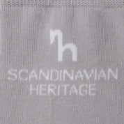 Close-up view of the Scandinavian Heritage horse logo on the gray Horze Noya Knee Socks