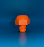 An orange plastic threaded cap with a rounded top, shown standing upright on a reflective blue gradient background.