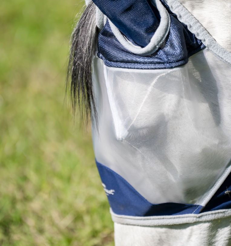 Close-up of Horseware Shield Fly Mask in navy and silver showing mesh eye area
