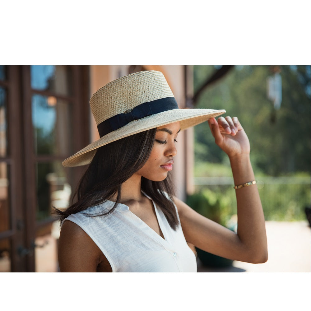 Model wearing the Dorfman Milano Diego Hat in Natural outside