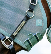 Close-up of Horseware Newmarket Fly Mask in Witney Dynasty showing chin strap and leather halter with Horseware metal plate