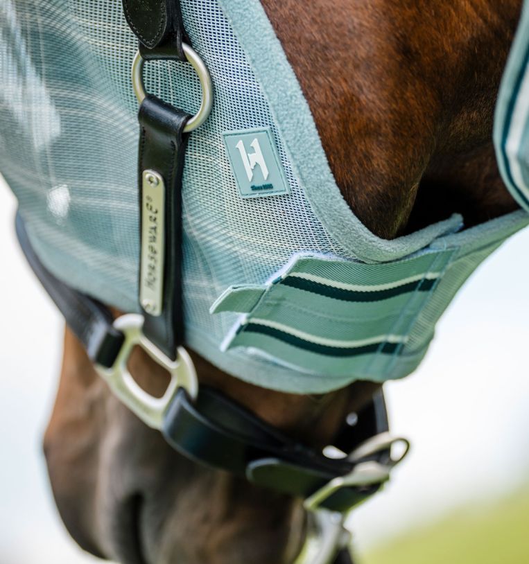 Close-up of Horseware Newmarket Fly Mask in Witney Dynasty showing lower front closure and leather halter