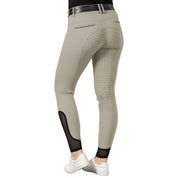 Back view of a model wearing the tan Equinavia Victoria Full Seat Breeches on a white background