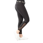 Side view of a model wearing the black Equinavia Victoria Full Seat Breeches on a white background