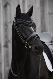 Angled front view of a black horse wearing the black Eskadron Crystal Fly Hood