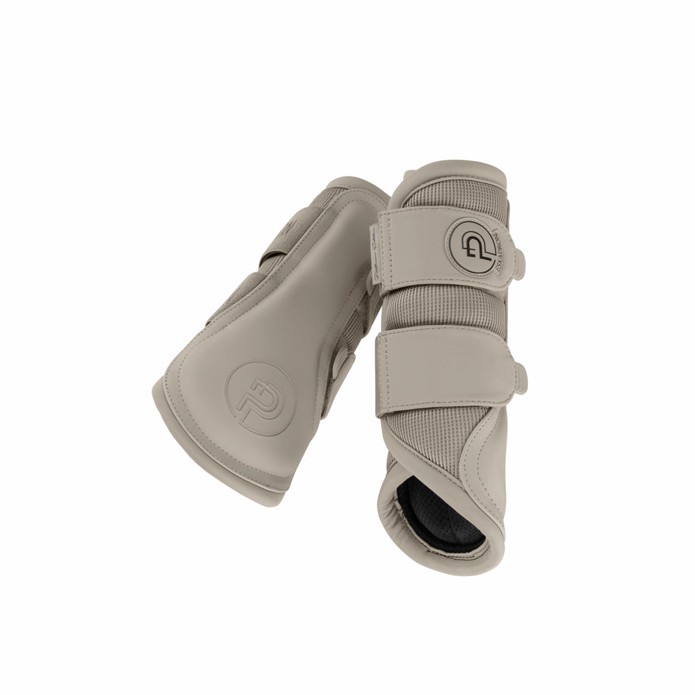 Inside and outside views of a pair of Pale Grey Eskadron Mesh Tendon Boots on a white background