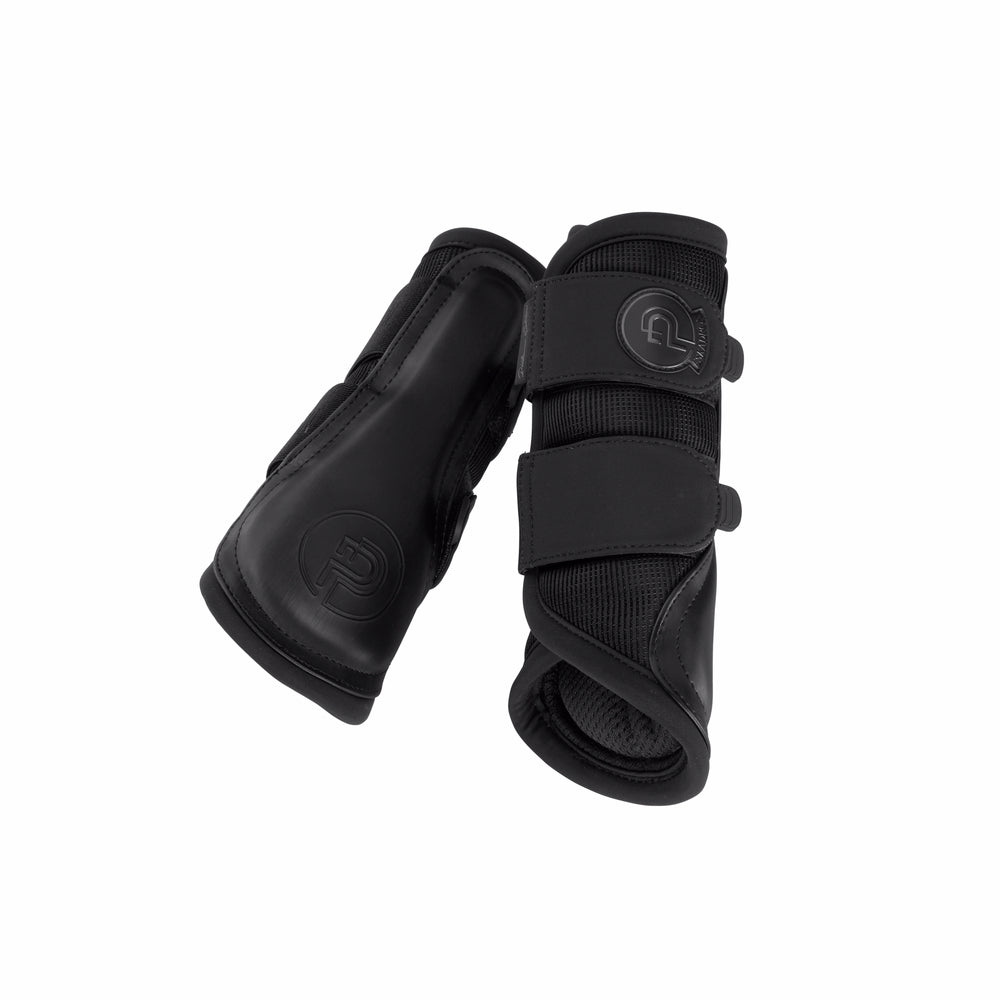 Inside and outside views of a pair of black Eskadron Mesh Tendon Boots on a white background
