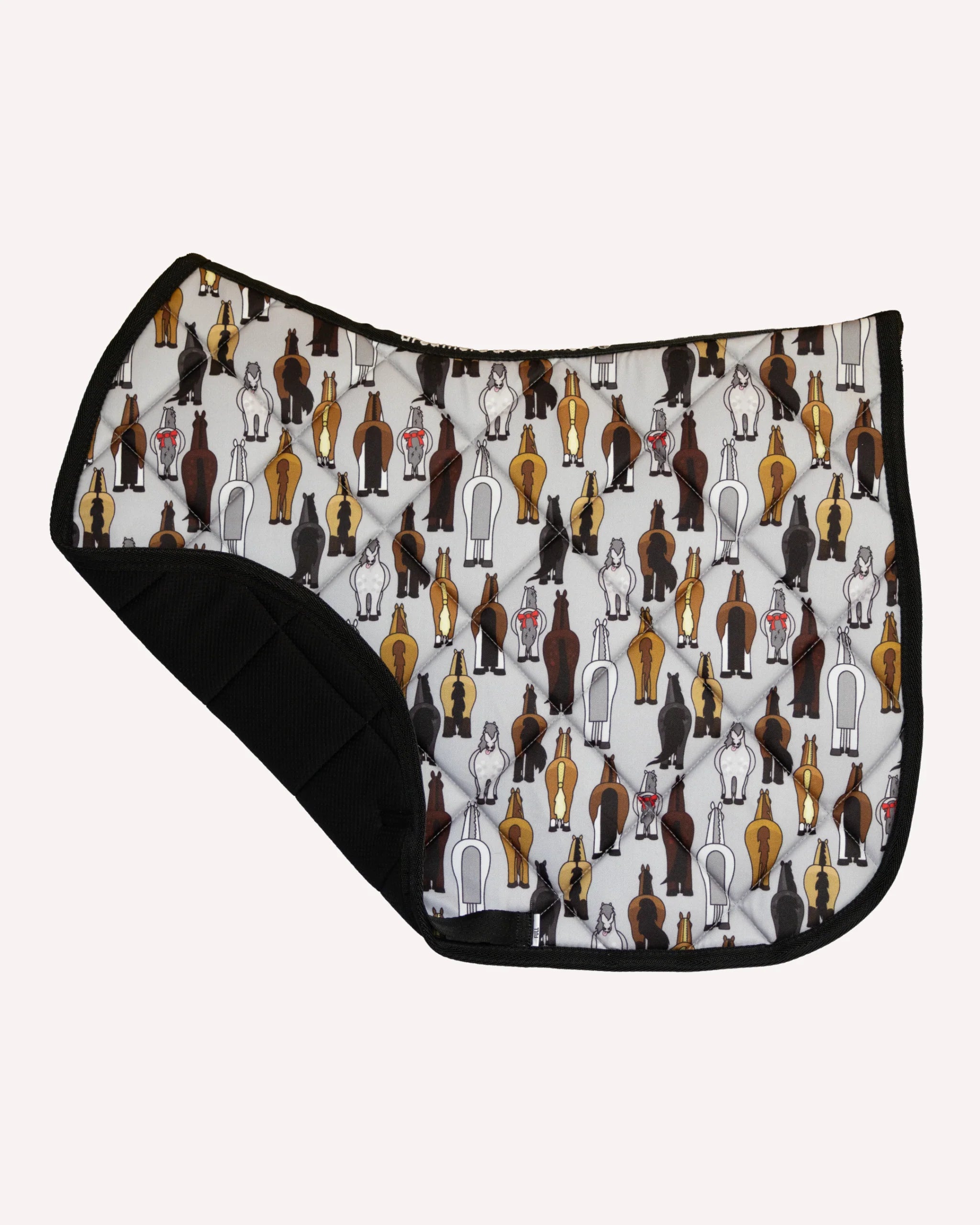 Side view of the Butts Dreamers & Schemers Saddle Pad on a plain background with the corner turned up to show the mesh lining