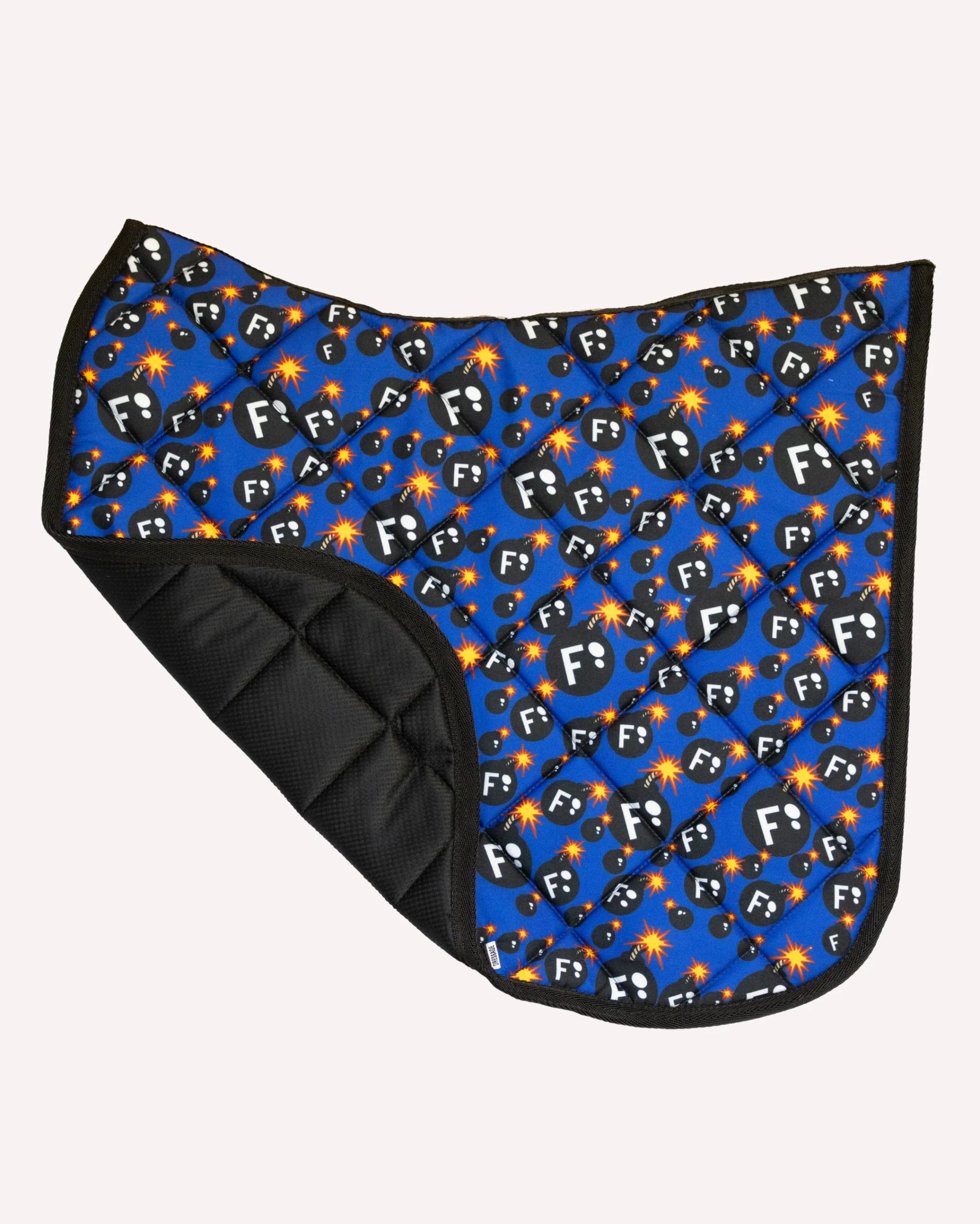 Side view of the F Bomb Dreamers & Schemers Saddle Pad on a plain background with the corner turned up to show the mesh lining