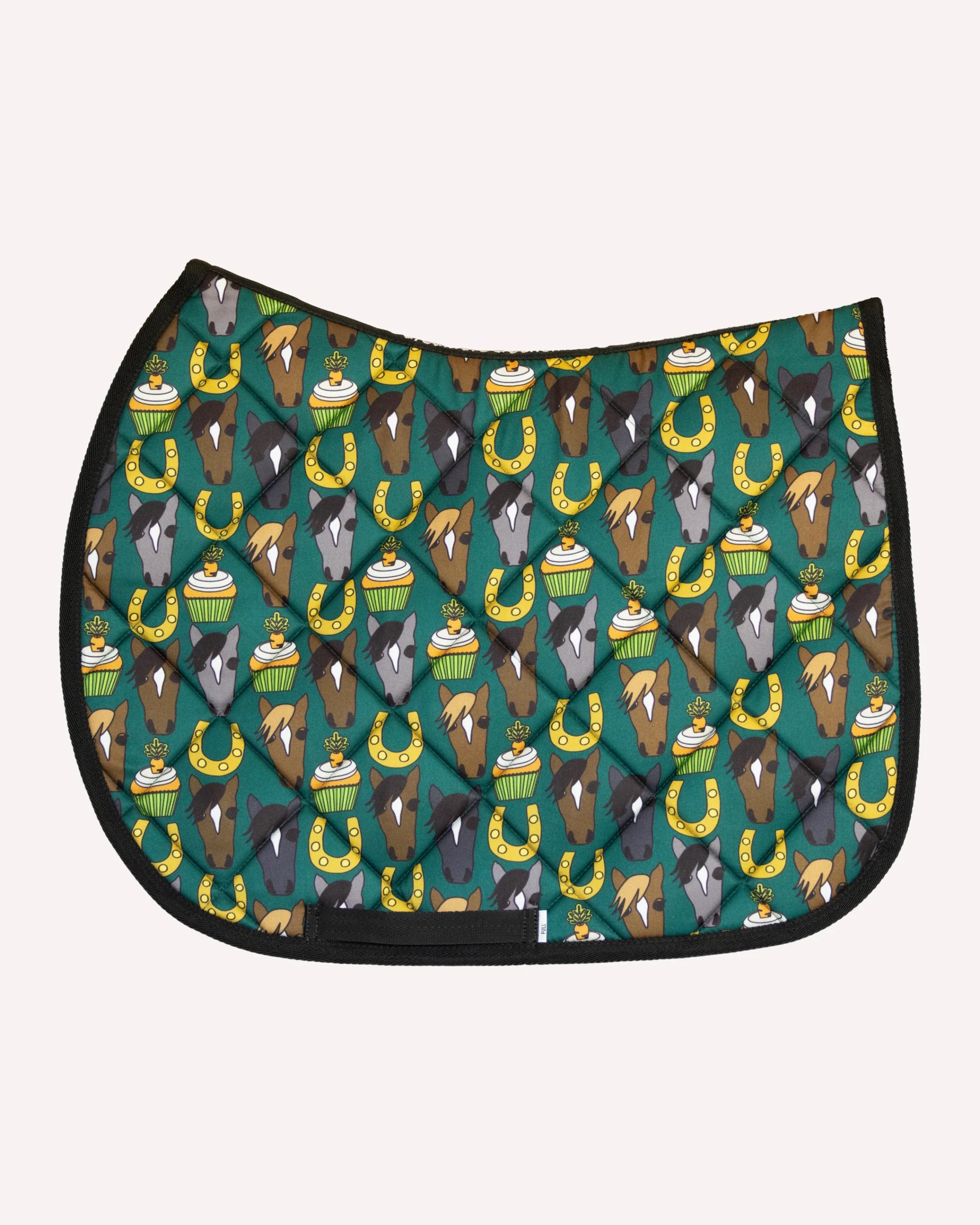Side view of the Carrot Cake Dreamers & Schemers Saddle Pad on a white background