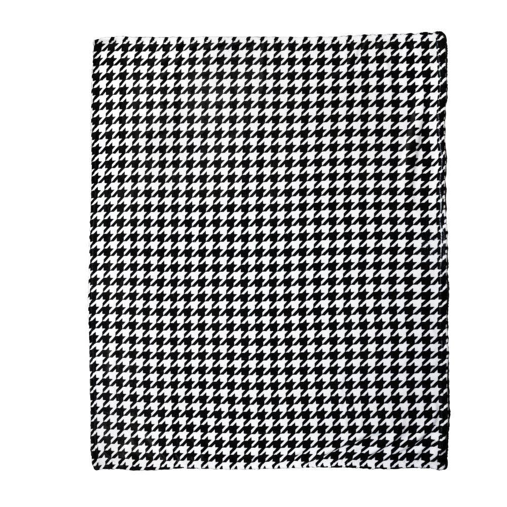 Full view of the Blue Stallion Farm Black & White Houndstooth Flannel Fleece Blanket in Leather Holder on a white background