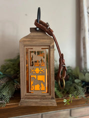 Side view of the dressage All Designs Equine Horse Lantern sitting on a mantle
