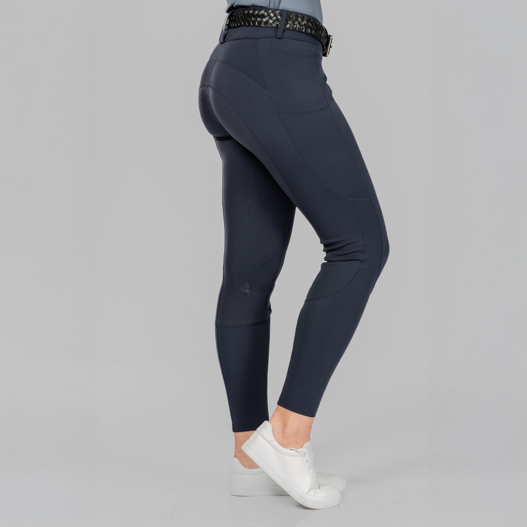 Side view of a model wearing Navy Equinavia Birgit Summer Full Seat Breeches on a plain background