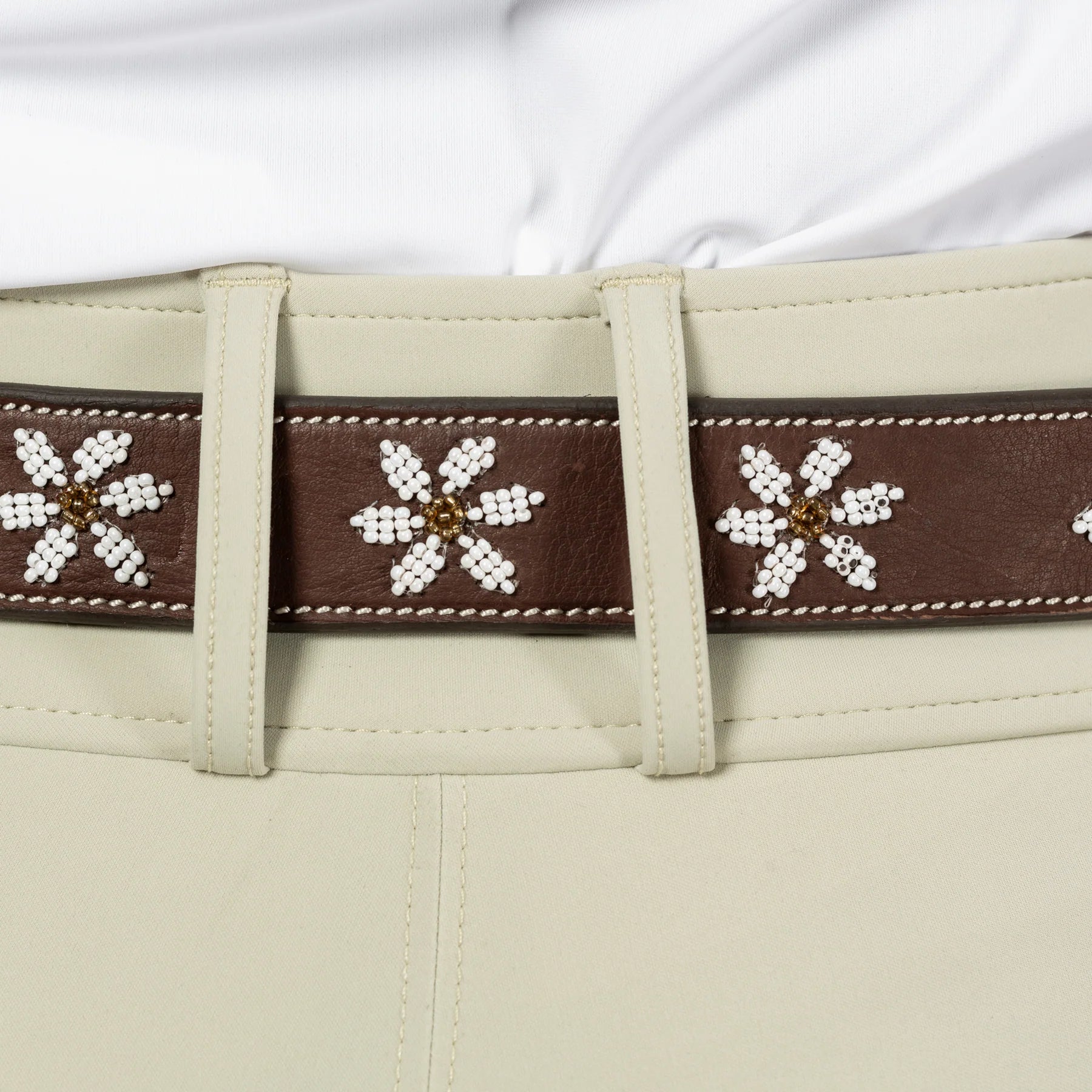 Back view closeup of a model wearing Dark Brown/Flowers Equinavia Adeline Beaded Belt