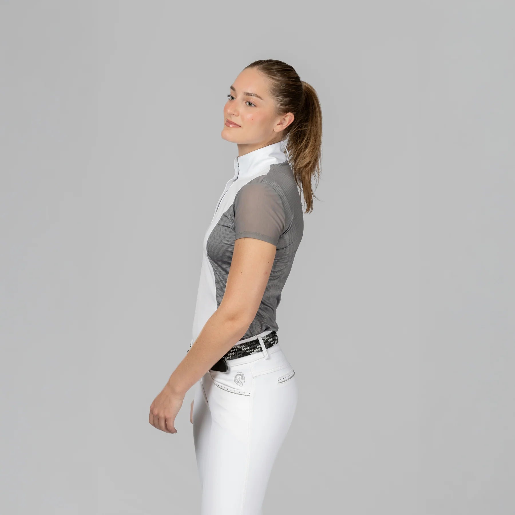 Side view of a model wearing Brushed Nickel Equinavia Martha Short Sleeve Show Shirt on a plain background