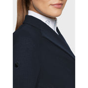Close-up side view of a female model wearing the Navy Samshield Frac Air on a plain background