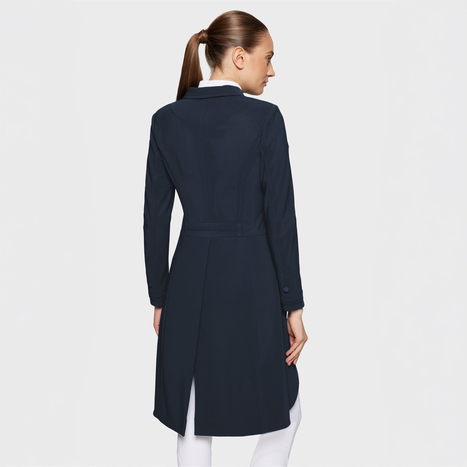 Back view of a female model wearing the Navy Samshield Frac Air on a plain background