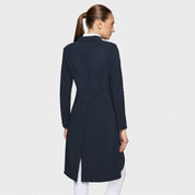 Back view of a female model wearing the Navy Samshield Frac Air on a plain background