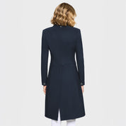 Back view of a female model wearing the Navy Samshield Frac Crystal Fabric Show Coat on a plain background