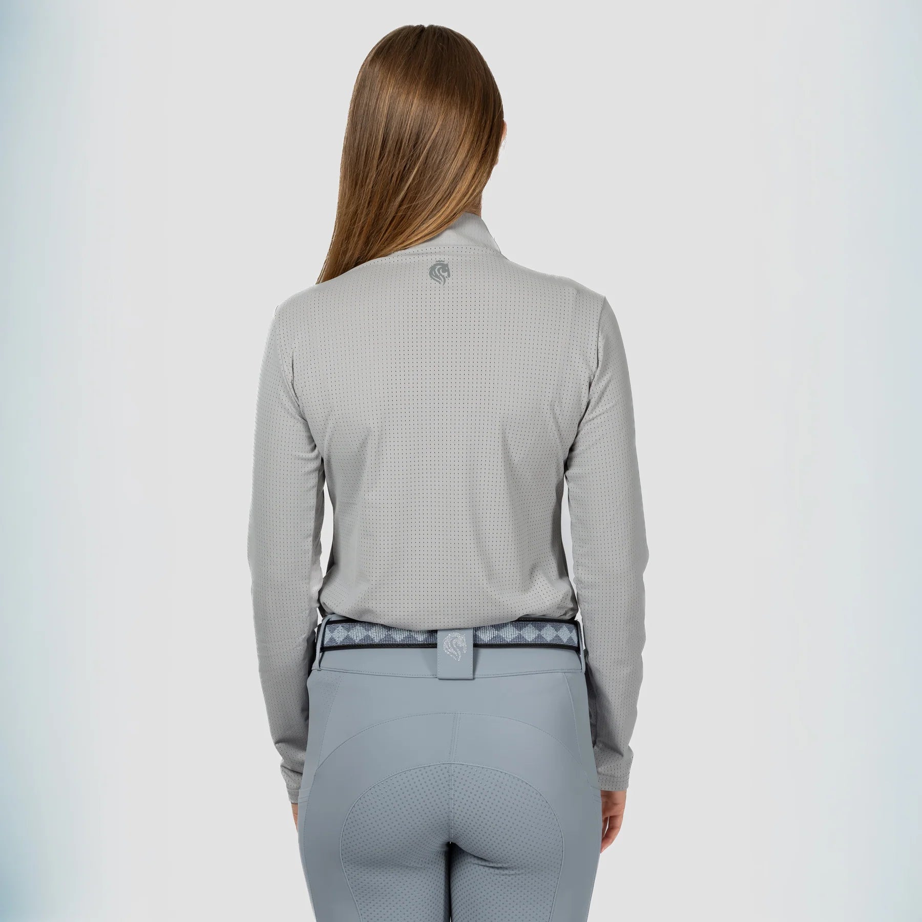 Back view of a model wearing Dapple Gray Equinavia Juni Long Sleeve Quarter Zip Shirt on a plain background