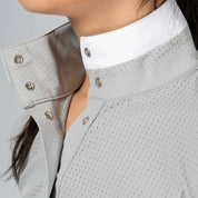 Angled view of a model wearing Dapple Gray Equinavia Juni Long Sleeve Show Shirt on a plain background showing the buttons up close