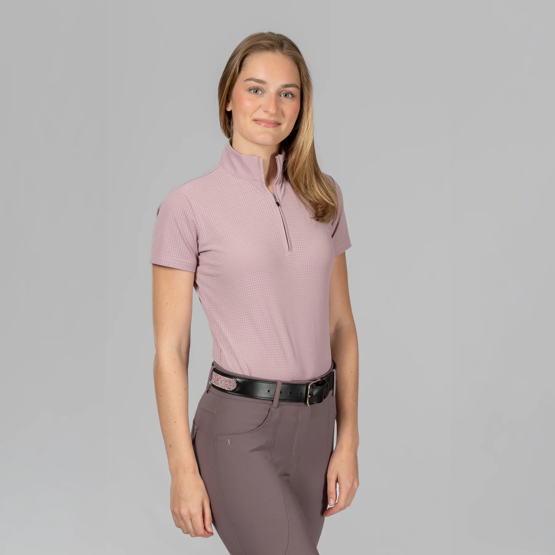 Angled front view of a model wearing Mellow Rose Equinavia Juni Short Sleeve Quarter Zip Shirt on a plain background