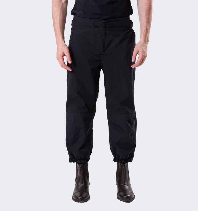 Model wearing Horseware H2O Trousers in black, front view with riding boots