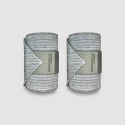 View of a pair of grey Incrediwear Circulation Exercise Bandages on a plain background