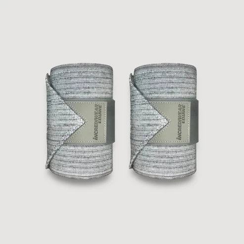 View of a pair of grey Incrediwear Circulation Exercise Bandages on a plain background