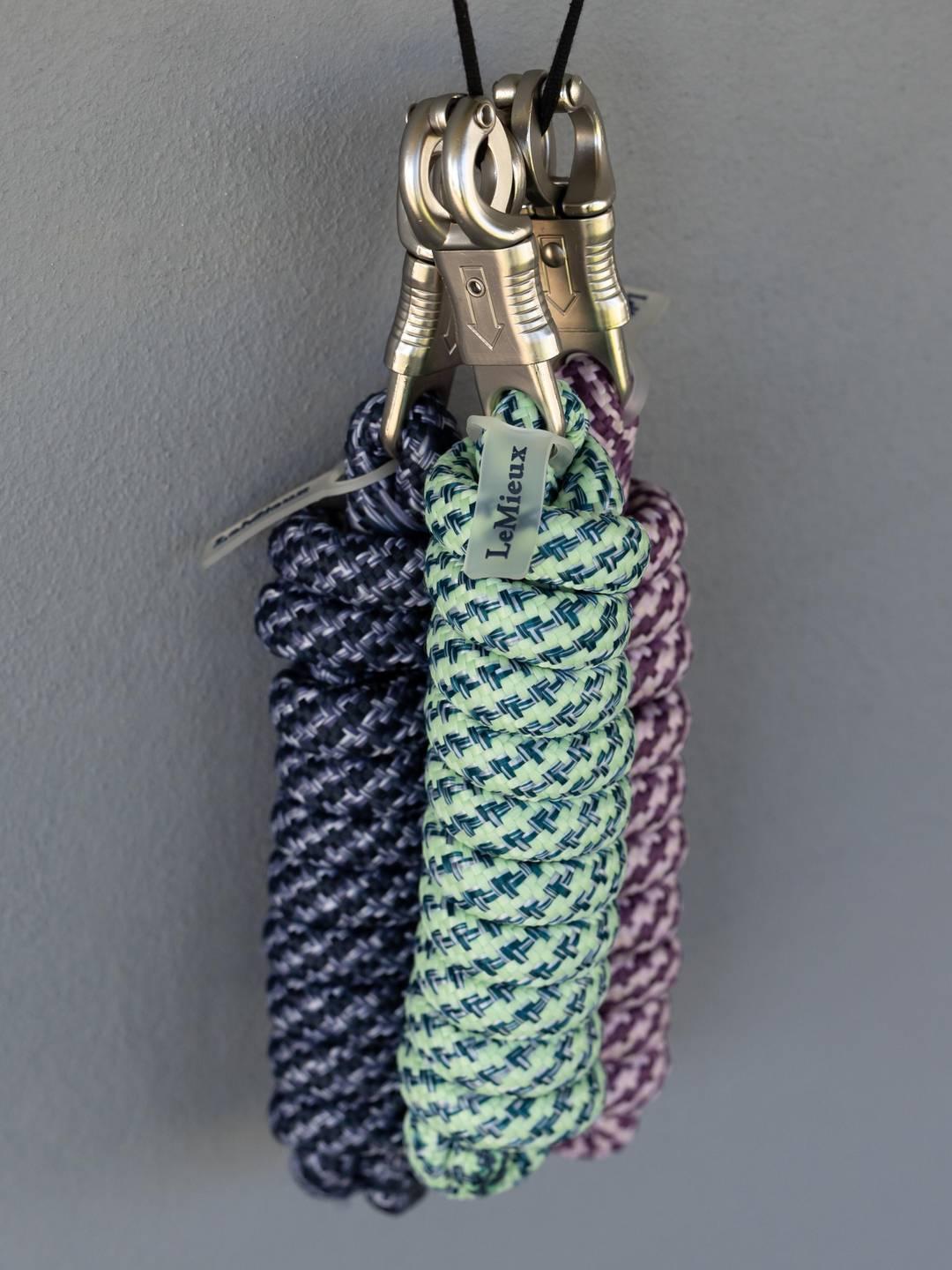 View of a group of LeMieux Quick Release Leadropes in assorted colors on a gray background