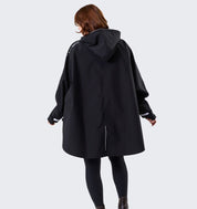 Model wearing Horseware H2O Poncho in black, back view