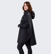 Model wearing Horseware H2O Poncho in black, side view