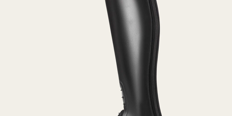 Side view of the black Ariat Heritage Contour II Field Zip Tall Riding Boot on a gray background