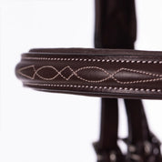 Close-up view of the browband on the Equinavia Valkyrie Fancy Stitched Figure 8 Bridle & Reins on a plain background