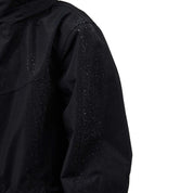 Close up back view of the sleeve on the navy Horze Fiora Kids Lightweight Waterproof Jacket on a white background