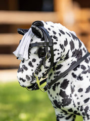 Side view of a leopard appaloosa toy pony wearing the black LeMieux Toy Pony Western Bridle