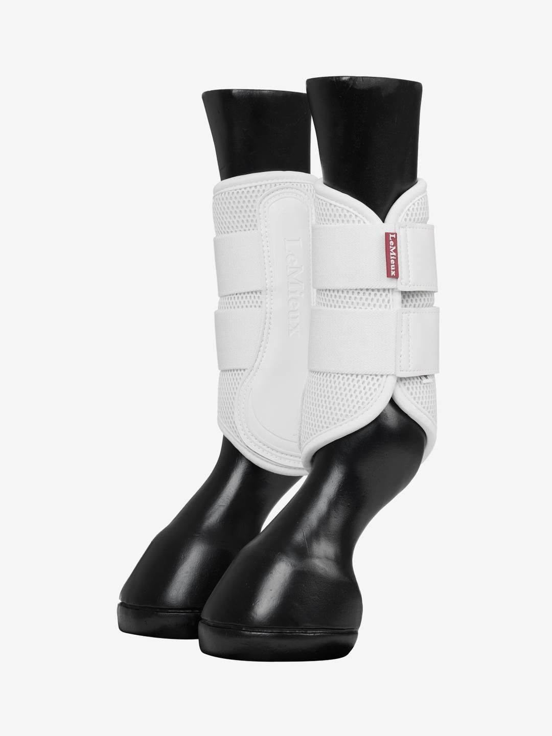Pair of white LeMieux Mesh Brushing Boots on plastic horse legs
