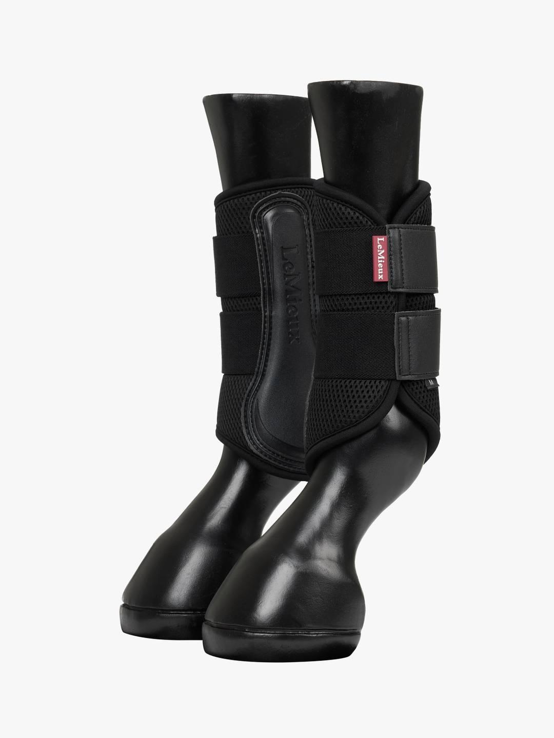 Pair of black LeMieux Mesh Brushing Boots on plastic horse legs