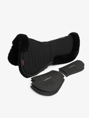 Full view of the black/black LeMieux Merino+ ProSorb 2 Pocket Half Pad and shims on a white background