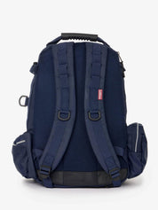 Back view of the navy LeMieux Pro Rucksack on a white background