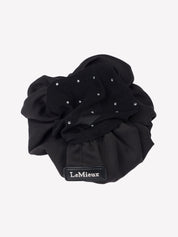 Top view of the black LeMieux Scrunchie With Crystal Hair Net on a plain background